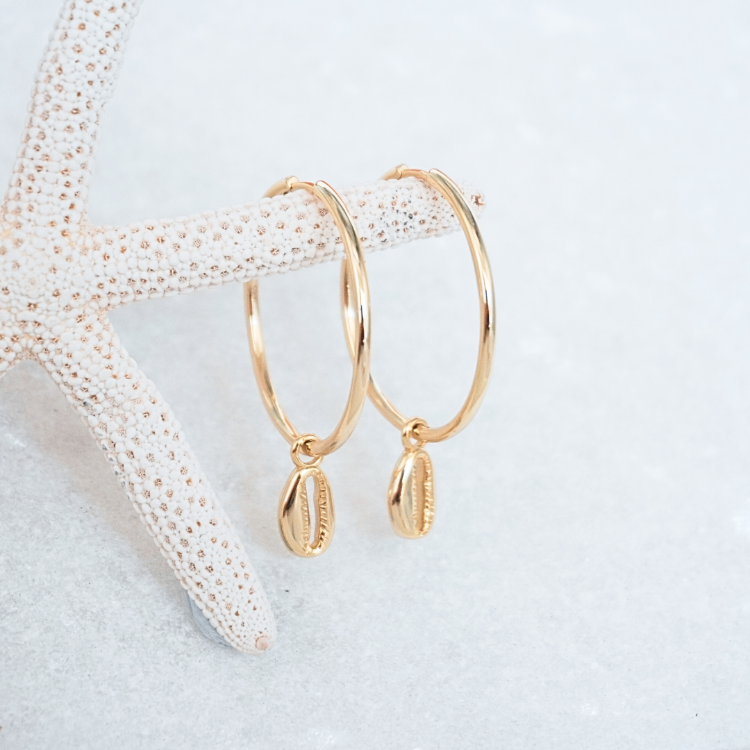 Large Gold Cali Hoops with cowrie pendant flat lay waterproof Kailumea
