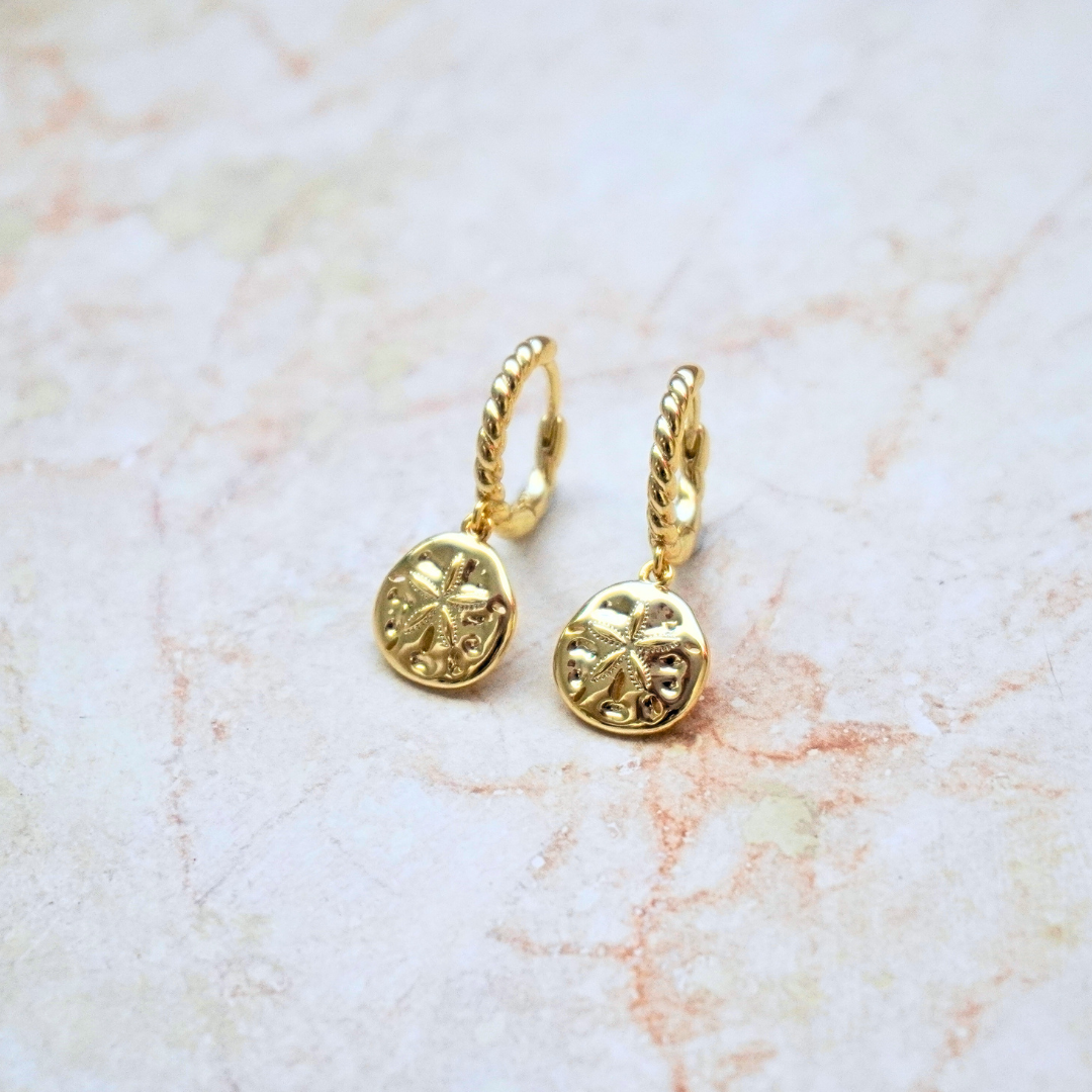 Isla Gold sand dollar hoop earrings flat lay. waterproof Kailumea