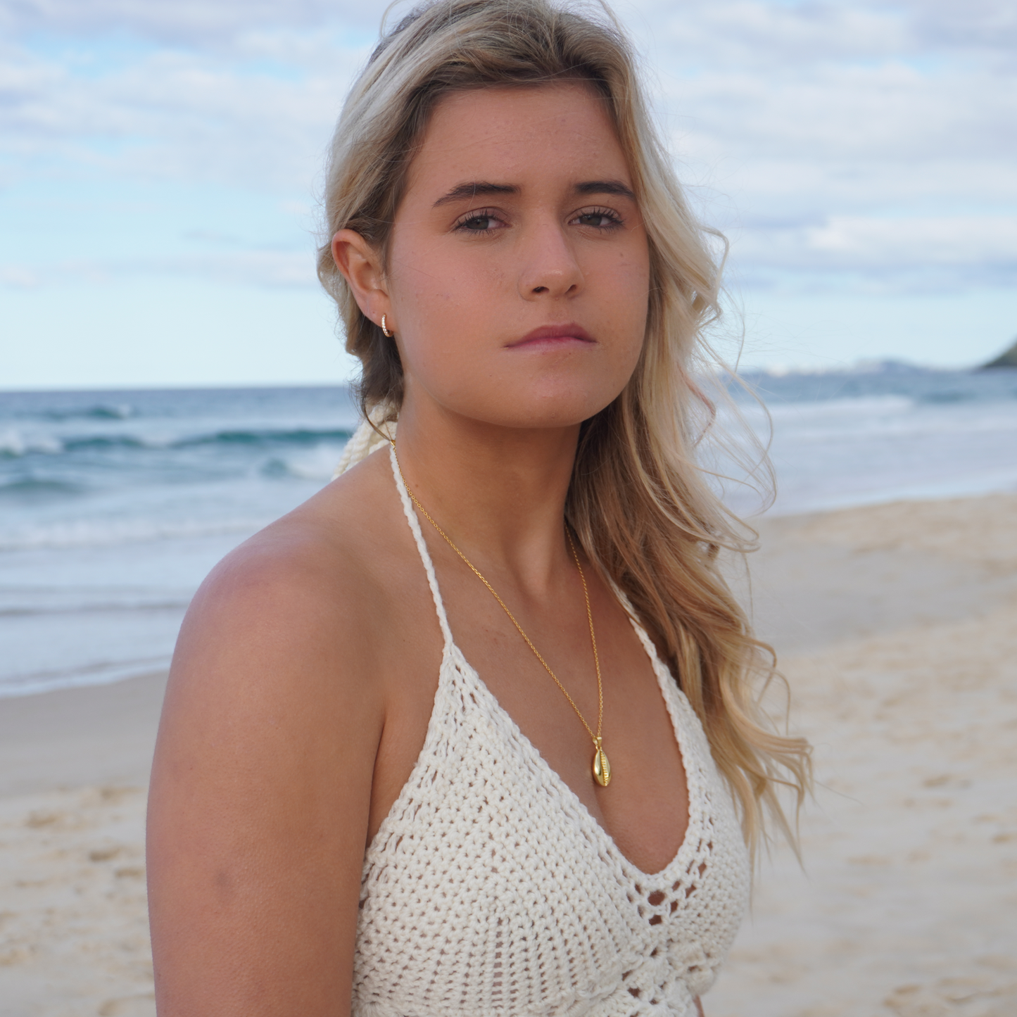 woman wearing Kalinda Huggie CZ Hoop Earrings waterproof Kailumea