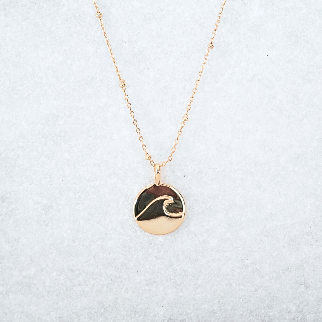 Kiki Wave pendant flat lay - waterproof gold kailumea