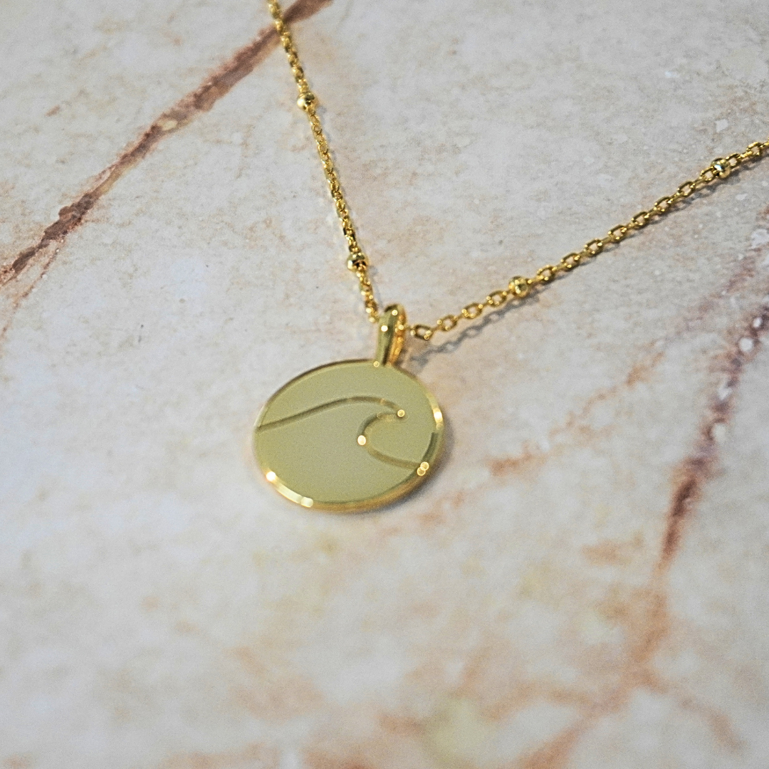 Kiki Wave pendant flat lay - waterproof gold kailumea