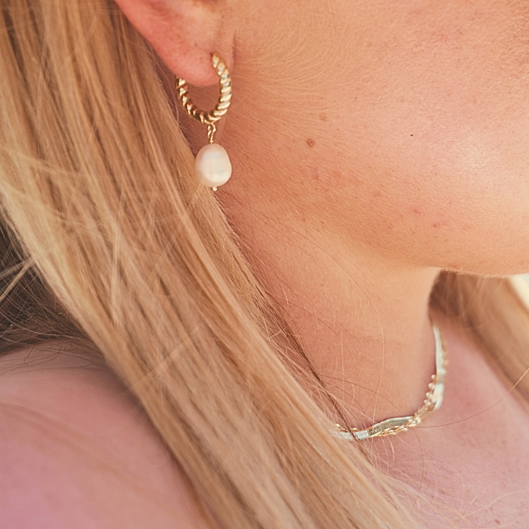 Close up in ear, woman wearing Luana Gold Pearl Pendant hoop earrings waterproof Kailumea
