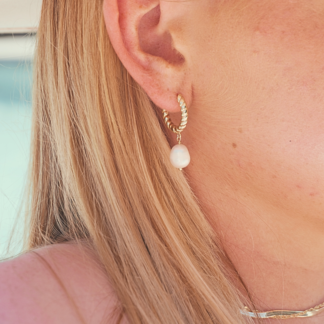 Close up in ear, woman wearing Luana Gold Pearl Pendant hoop earrings waterproof Kailumea