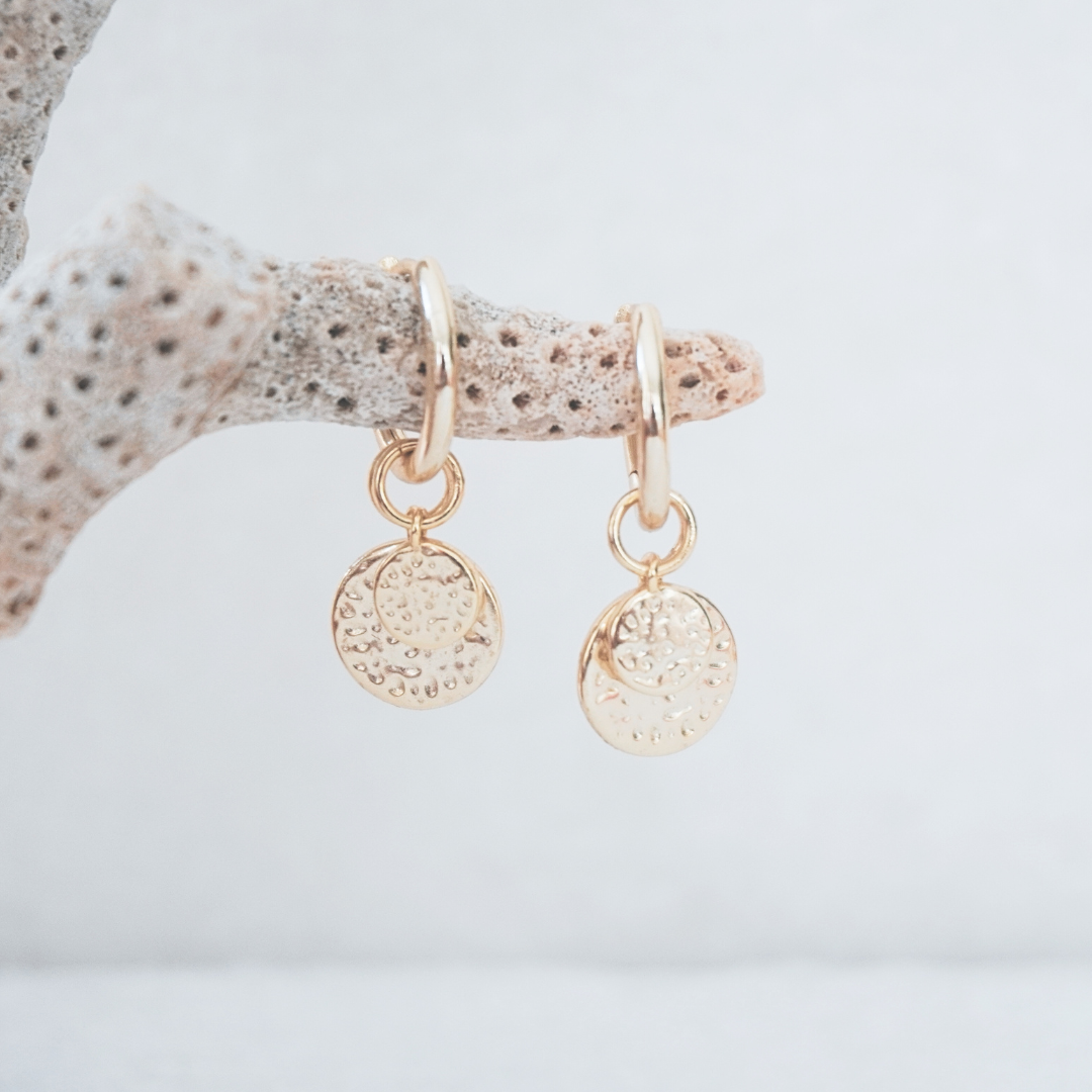 Soleil Hammerd gold pendant hoops flat lay. waterproof Kailumea