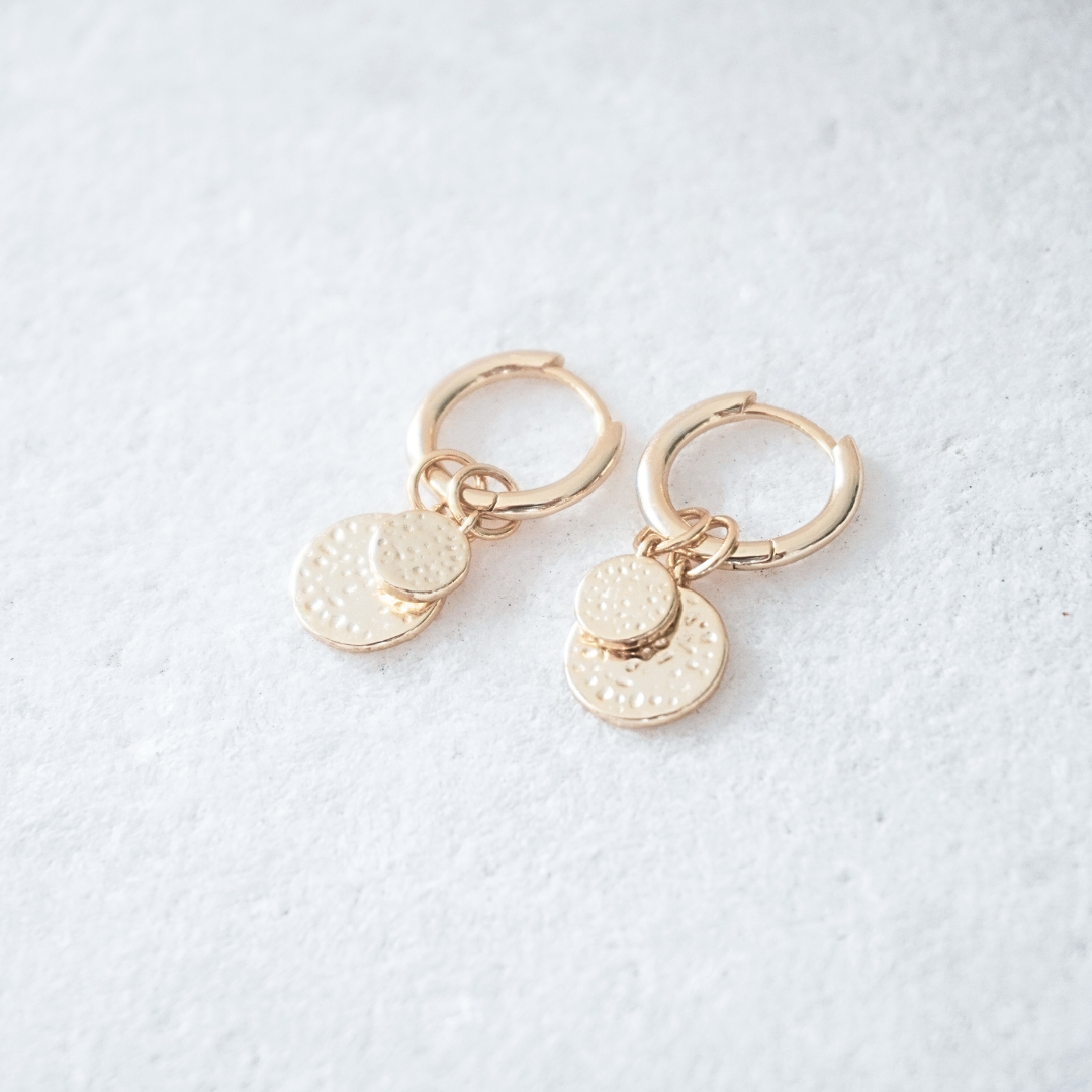 Soleil Hammerd gold pendant hoops flat lay. waterproof Kailumea