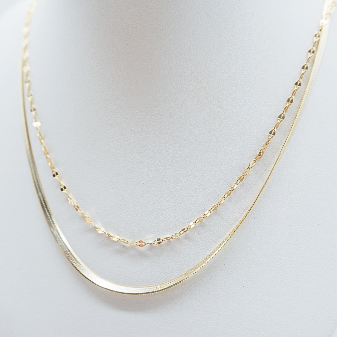 Mimi waterproof sparkle chain flat lay stacked with Zephyr gold herringbone chain. ocean safe layering-Kailumea
