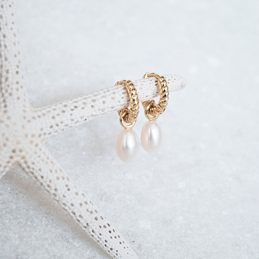 Delmar Gold Pearl Huggie Hoops flat lay waterproof Kailumea