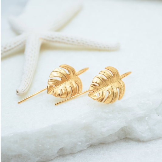 Gold Waterproof La Isla Threads Monstera Leaf Thread Earrings flat lay Kailumea