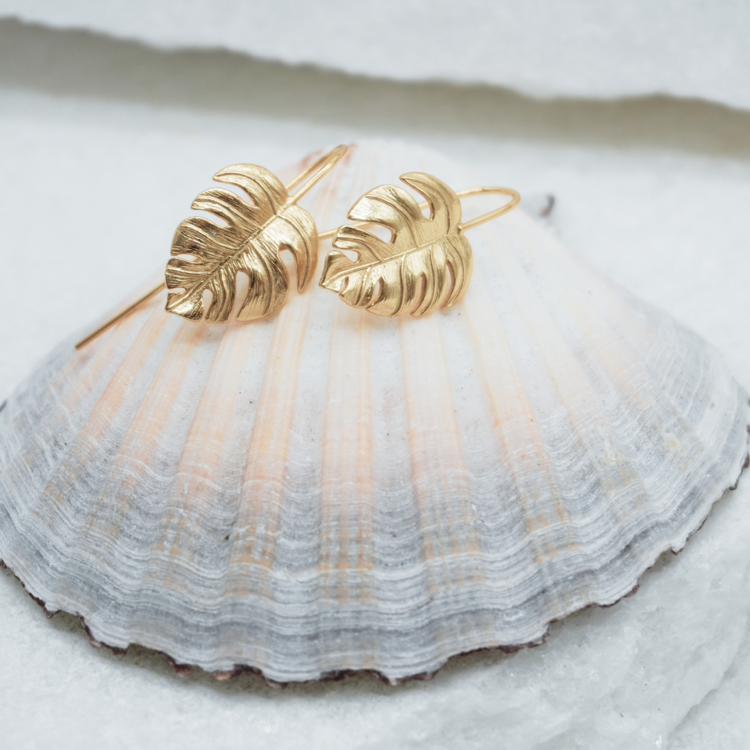 Gold Waterproof La Isla Threads Monstera Leaf Thread Earrings flat lay Kailumea