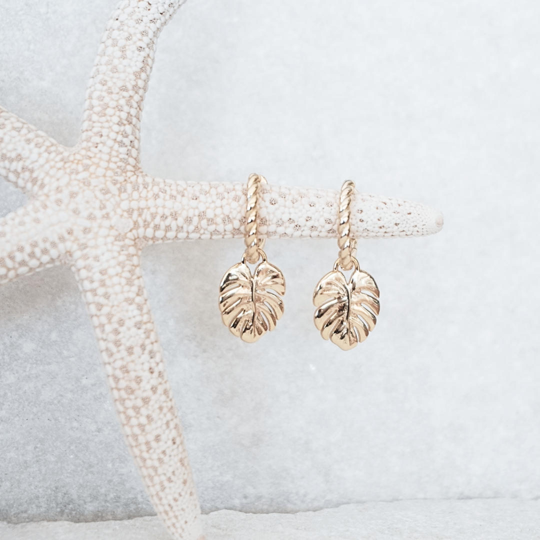 Mahina Gold Monstera leaf pendant hoop earring flat lay waterproof Kailumea