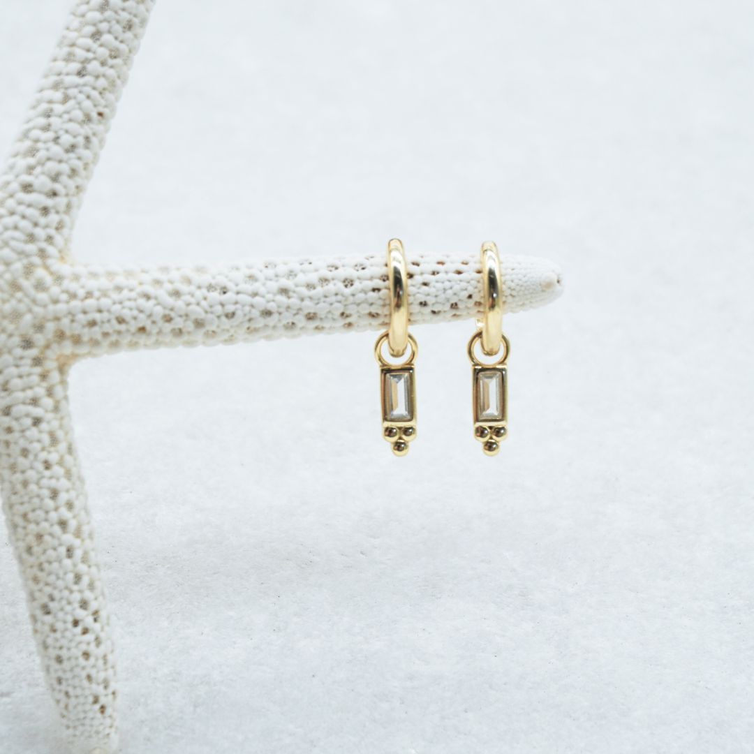 Pavana Gold Baguette Stone huggie hoop earring flat lay waterproof kailumea