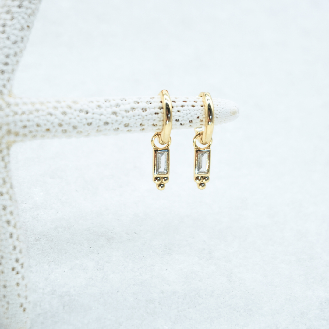 Pavana Gold Baguette Stone huggie hoop earring flat lay waterproof kailumea