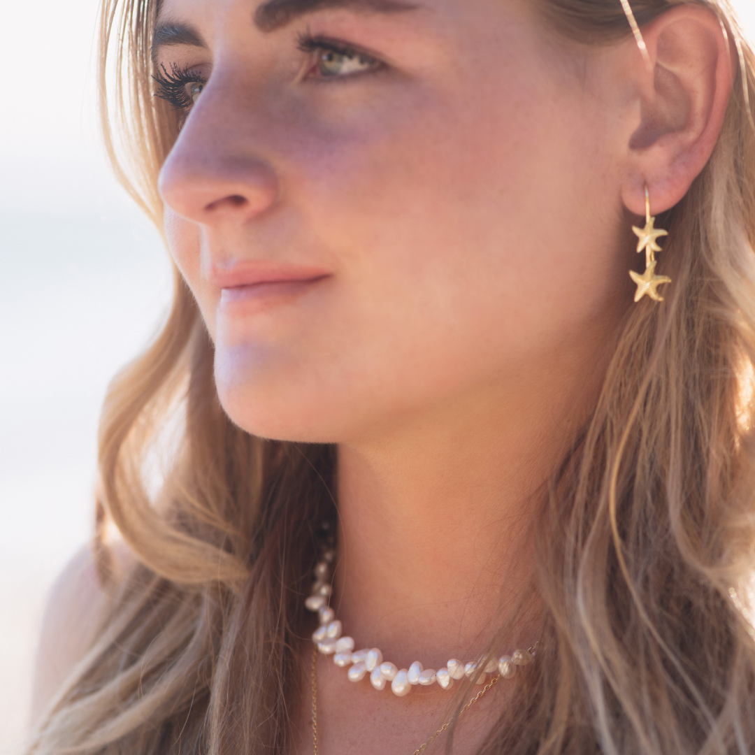 Woman wearing Starla Starfish Gold Thread Earrings waterproof Kailumea and Luna Tide necklace