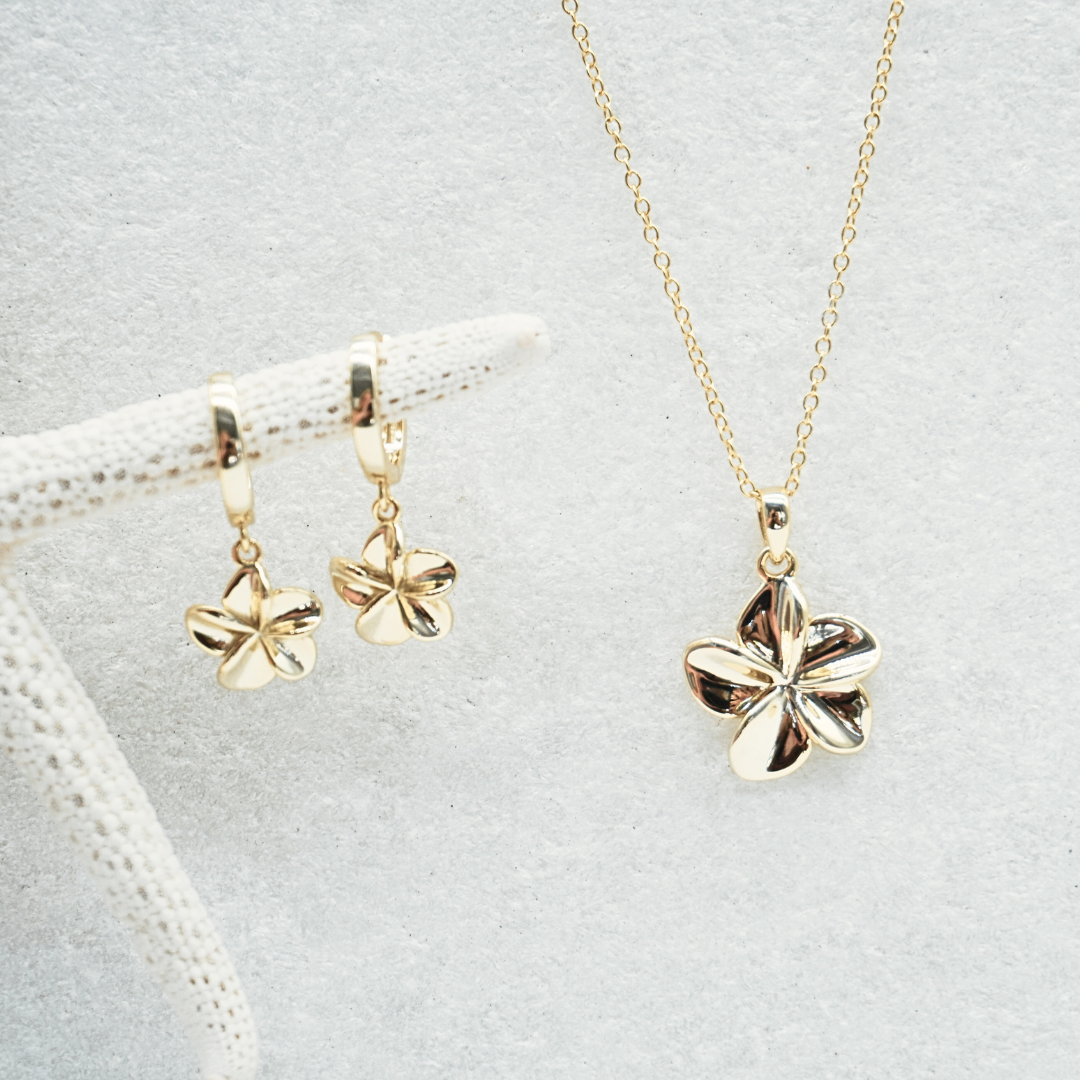 Tahiti Frangipani pendant hoop earrings and matching frangipani necklace flat  lay- waterproof gold Kailumea