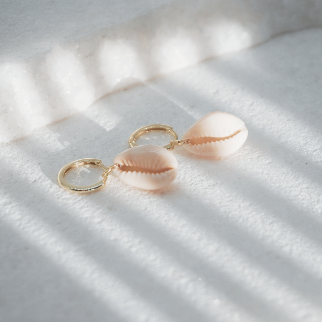 Tehani cowrie shell earrings flat lay- waterproof gold Kailumea