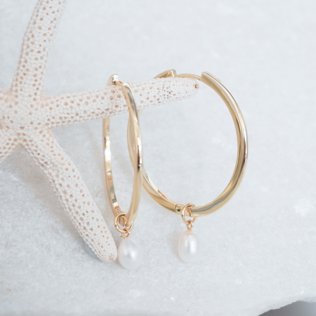 Waikiki Large Gold hoops with pearl charm pendant flat lay. waterproof Kailumea